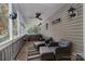 Relaxing screened-in porch with comfortable seating and ceiling fan at 1575 Lewis Farm Rd, Kings Mountain, NC 28086