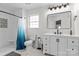 Bright bathroom with stylish fixtures, a shower with decorative tile, and a vanity at 176 Pleasant Grove Ln, Mooresville, NC 28115