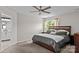 Comfortable bedroom with neutral tones, a ceiling fan, and natural light at 176 Pleasant Grove Ln, Mooresville, NC 28115