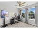 A modern bedroom featuring a dedicated desk area and two windows providing natural light at 176 Pleasant Grove Ln, Mooresville, NC 28115