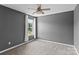 Gray bedroom with carpet, neutral curtains and a window bringing in natural light at 176 Pleasant Grove Ln, Mooresville, NC 28115