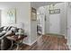Inviting entryway features hardwood floors, neutral paint, and a view into the adjacent living space at 176 Pleasant Grove Ln, Mooresville, NC 28115