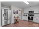 Well-lit kitchen features stainless steel appliances, bright cabinetry, and a convenient island at 176 Pleasant Grove Ln, Mooresville, NC 28115