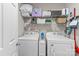 Functional laundry room with shelving and washer and dryer at 176 Pleasant Grove Ln, Mooresville, NC 28115