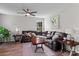 Cozy living room with a plush sectional sofa, hardwood floors, and a ceiling fan at 176 Pleasant Grove Ln, Mooresville, NC 28115