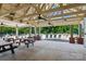 A covered pool area with picnic tables and lounge chairs surrounding the community pool at 176 Pleasant Grove Ln, Mooresville, NC 28115
