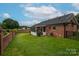 Lovely brick home featuring an enclosed porch, brick fence and lush lawn for outdoor enjoyment at 1909 Wexford Ct, Gastonia, NC 28054