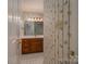 Bathroom featuring wooden vanity, and a shower with glass doors at 1909 Wexford Ct, Gastonia, NC 28054