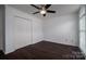 Cozy bedroom with hardwood floors, ceiling fan, and a spacious closet at 1909 Wexford Ct, Gastonia, NC 28054