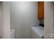 Laundry room featuring a washer and dryer set with overhead cabinet at 1909 Wexford Ct, Gastonia, NC 28054
