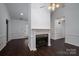 Cozy living room featuring a fireplace and dark hardwood floors at 1909 Wexford Ct, Gastonia, NC 28054