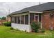 Screened porch with a brick foundation and an attached brick home at 1909 Wexford Ct, Gastonia, NC 28054
