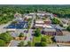 Aerial view of a charming small town with traditional buildings and lush greenery at 204 Blanche Ave, Belmont, NC 28012