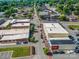 Overhead shot showcasing a well-organized town layout with commercial buildings, trees, and streetscape at 204 Blanche Ave, Belmont, NC 28012
