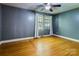 Bedroom featuring hardwood floors, neutral walls, and a window bringing in natural light at 204 Blanche Ave, Belmont, NC 28012