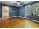 Bedroom featuring hardwood floors, neutral walls, walk-in closet and bright window at 204 Blanche Ave, Belmont, NC 28012