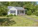 Charming home with a well maintained front yard, covered porch and driveway at 204 Blanche Ave, Belmont, NC 28012