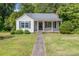 Charming single-story home with white siding, inviting front porch and well-maintained front lawn at 204 Blanche Ave, Belmont, NC 28012