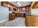 Well-lit kitchen featuring wooden cabinets, modern appliances, and an island with sink at 204 Blanche Ave, Belmont, NC 28012