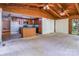 Open living area with wood beam ceilings, and kitchen access, offering a seamless flow for modern living at 204 Blanche Ave, Belmont, NC 28012