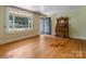 Inviting living room with hardwood floors, and a vintage organ near a bright window at 204 Blanche Ave, Belmont, NC 28012