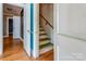 Stairwell featuring wooden stairs and an open door at 204 Blanche Ave, Belmont, NC 28012