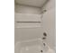 Bathroom featuring white tiled shower and tub combo with brushed nickel fixtures at 2214 Grimes St, Charlotte, NC 28206