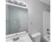 A gray bathroom with white subway tiles and updated sink at 2214 Grimes St, Charlotte, NC 28206