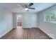 A light blue bedroom featuring hardwood floors and ensuite bath access at 2214 Grimes St, Charlotte, NC 28206