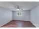 A light blue bedroom featuring modern ceiling fan and hardwood floors at 2214 Grimes St, Charlotte, NC 28206