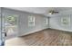 Well-lit living room with hardwood flooring and neutral paint at 2214 Grimes St, Charlotte, NC 28206