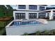 A backyard featuring a sparkling pool with hot tub, perfect for outdoor enjoyment at 268 Hermance Ln, Mooresville, NC 28117