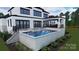 An inviting backyard pool area with a hot tub, perfect for relaxation and entertaining at 268 Hermance Ln, Mooresville, NC 28117