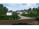 Expansive home with lush landscaping, mature trees, and a private driveway at 268 Hermance Ln, Mooresville, NC 28117