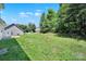 A spacious backyard, fenced in with mature trees at 2706 Stagbuck Dr, Gastonia, NC 28052