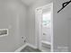 Clean laundry room with grey floors and white trim at 2706 Stagbuck Dr, Gastonia, NC 28052