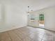 Bright dining space with tile floors, a door to the deck, and a stylish pendant light at 2927 Dubberly Ct, Matthews, NC 28105