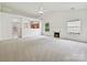 Spacious living area featuring vaulted ceilings, neutral carpeting, and a marble fireplace at 2927 Dubberly Ct, Matthews, NC 28105