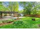 Backyard featuring a patio area, hammock, and mature landscaping at 2953 Enfield Rd, Charlotte, NC 28205