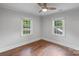 Bedroom with hardwood floors, two windows, and light walls at 2953 Enfield Rd, Charlotte, NC 28205