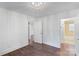 Bedroom featuring hardwood floors and two open doorways at 2953 Enfield Rd, Charlotte, NC 28205