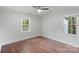 Bedroom with hardwood floors, neutral walls, and a ceiling fan at 2953 Enfield Rd, Charlotte, NC 28205