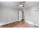 Bedroom featuring hardwood floors, a ceiling fan and a built-in wardrobe at 2953 Enfield Rd, Charlotte, NC 28205