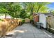 Long concrete driveway leads to a fenced backyard at 2953 Enfield Rd, Charlotte, NC 28205