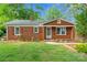 Charming brick home with well-maintained landscaping and a cozy entrance at 2953 Enfield Rd, Charlotte, NC 28205