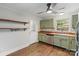 Kitchen area featuring stainless steel appliances, wooden countertops, and light green cabinetry at 2953 Enfield Rd, Charlotte, NC 28205