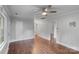 Spacious living room features hardwood floors, neutral paint, and open access to the other rooms at 2953 Enfield Rd, Charlotte, NC 28205
