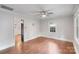 Well-lit living room boasting hardwood floors, freshly painted walls, and classic architectural trim at 2953 Enfield Rd, Charlotte, NC 28205