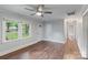 Open floor plan highlights hardwood floors, neutral walls, and easy access to entry and hallway at 2953 Enfield Rd, Charlotte, NC 28205