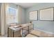 Bright office space with a wooden desk, chair, and large window providing natural light at 3019 Sassafrass Trl, Gastonia, NC 28056